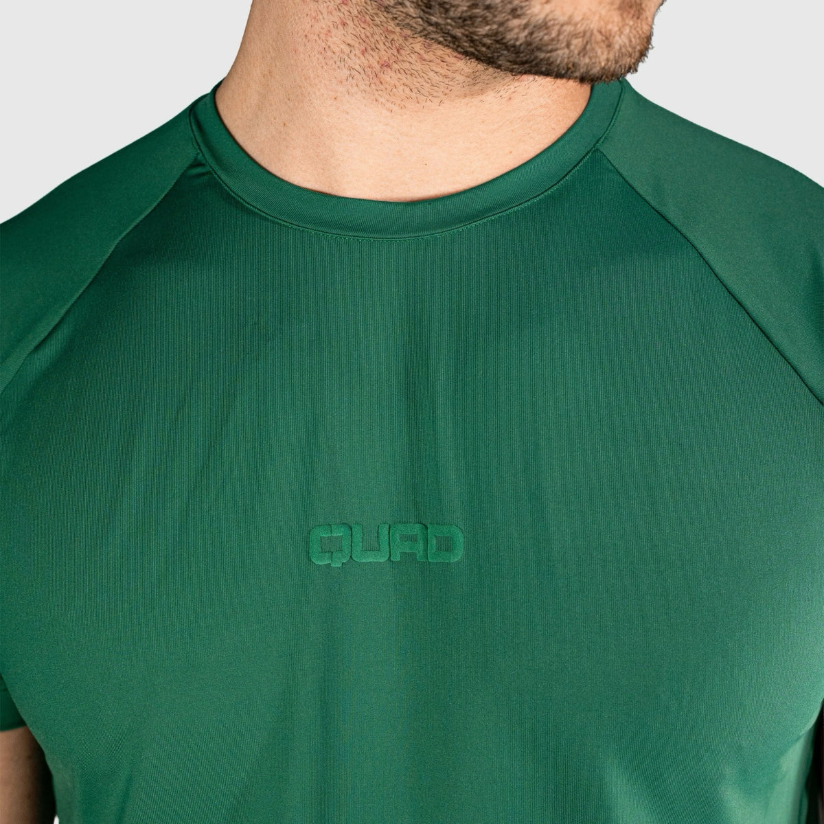 QUAD Ace Padel green T-shirt with 'QUAD' logo on a plain background