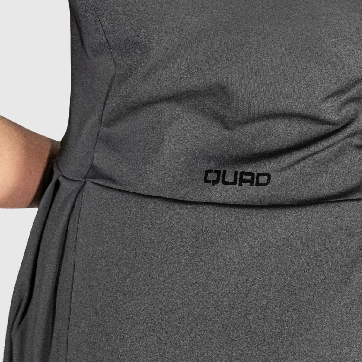 QUAD Frame Padel Dress with 'QUAD' branding on a light gray background