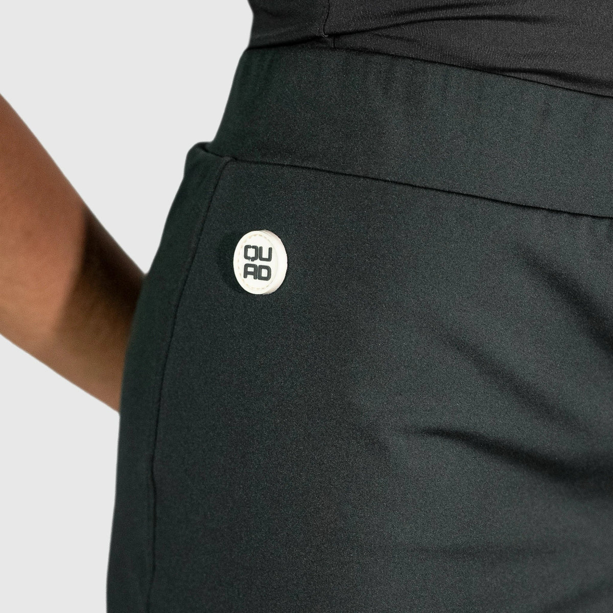 QUAD Halo Padel Skirt with a logo against a light gray background