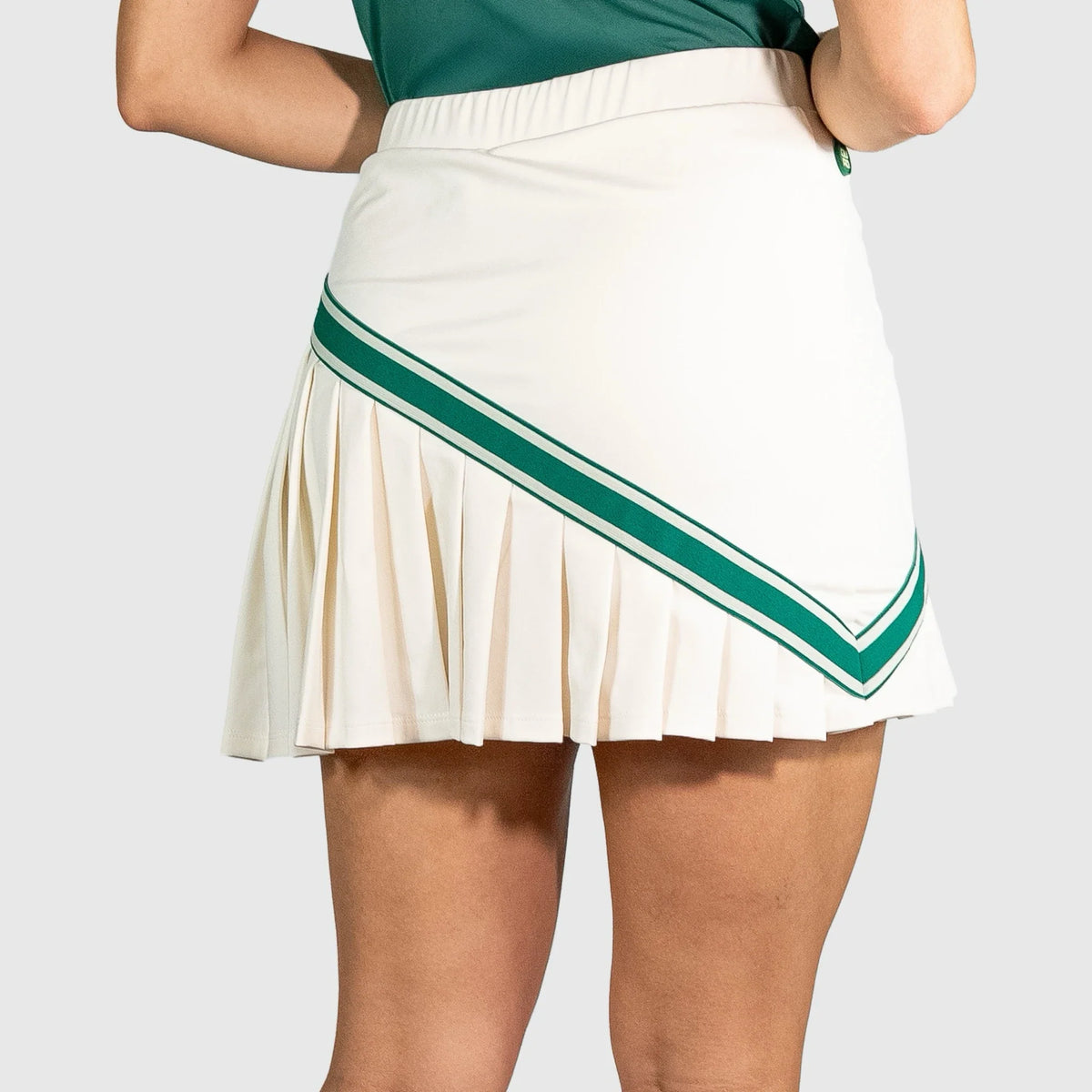 QUAD Halo Padel Skirt with green stripes worn by a person on a white background