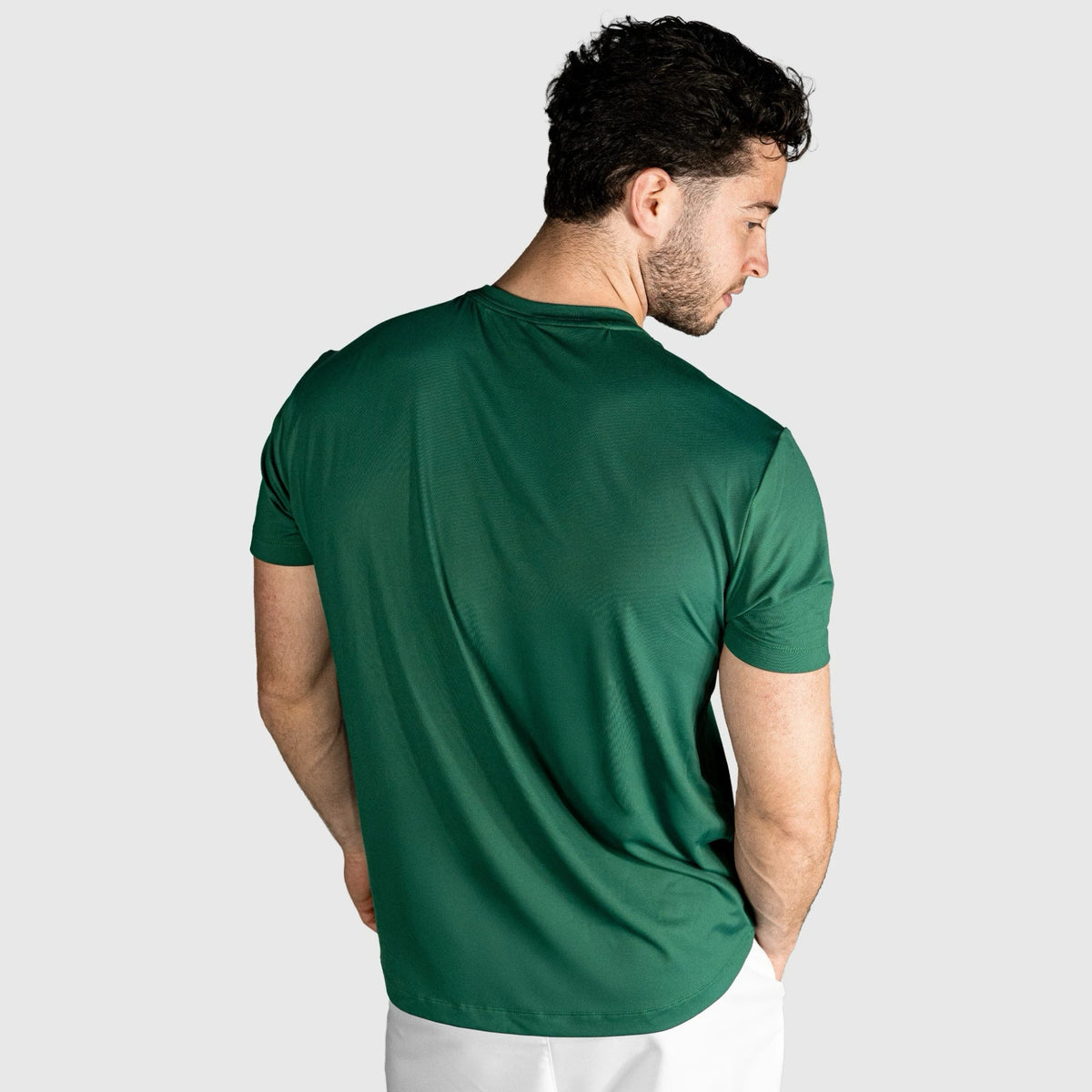 Man wearing a Impact Padel T-shirt-green  on a plain background