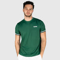 Man wearing a QUAD Match Padel T-shirt green with a brand logo on a white background