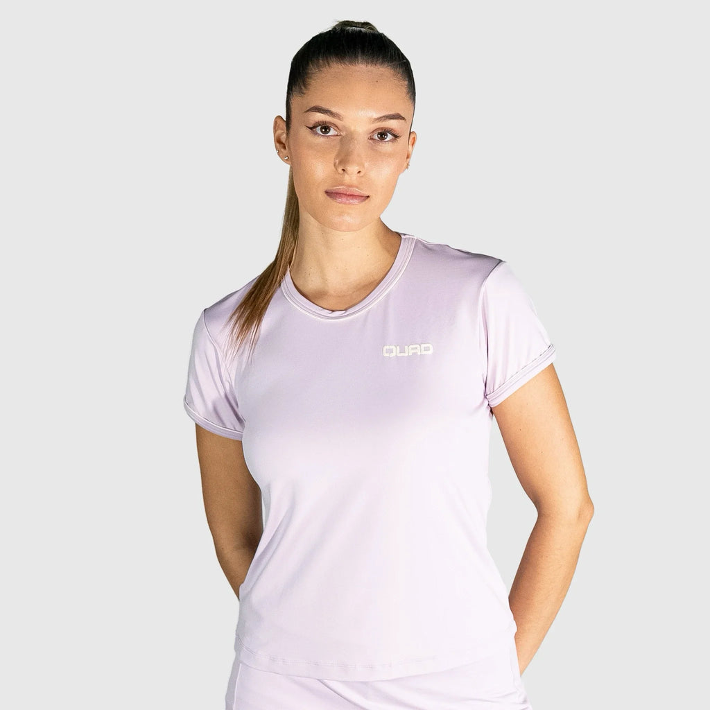 Woman wearing a New Regular Padel shirt  with a brand logo on a white background